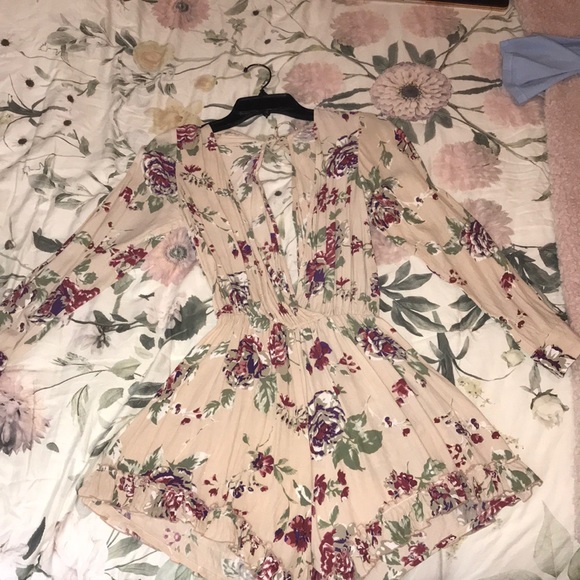 Faithfull the Brand Dresses & Skirts - Floral romper with deep v neck